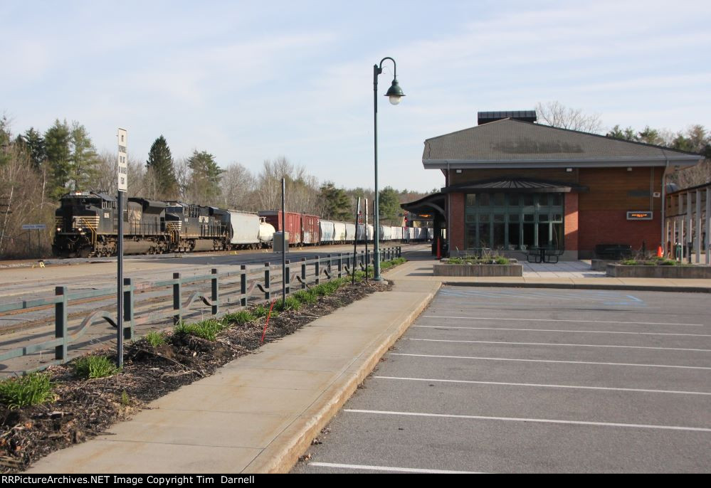 NS 1226 leads 228 past the Amtrak station.